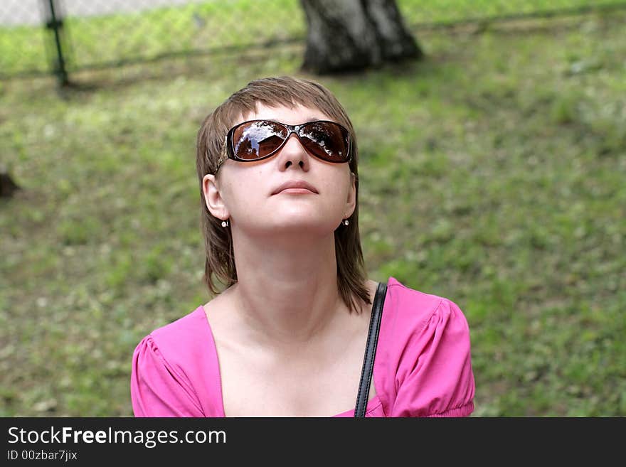 The girl in a green park in summer. The girl in a green park in summer