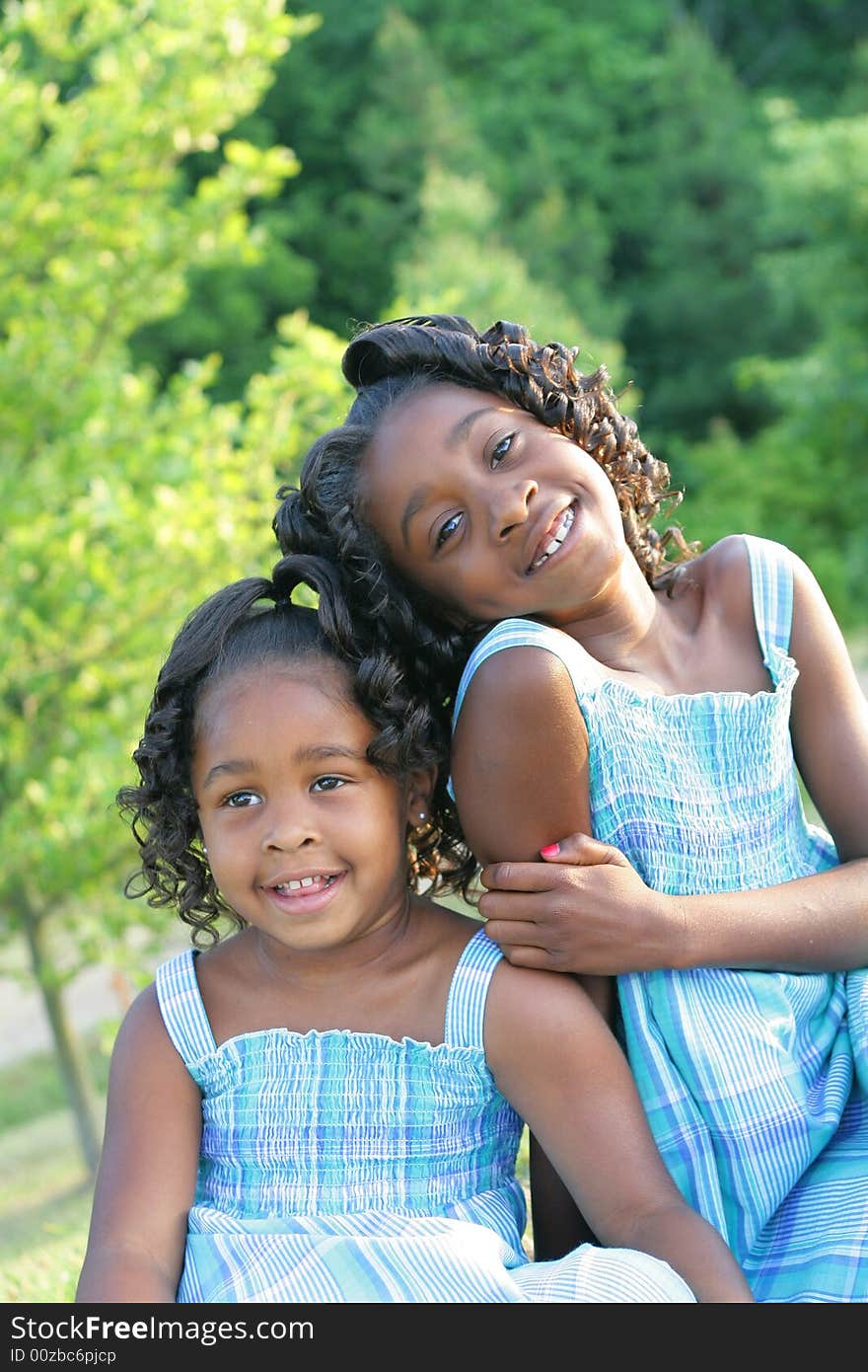 2 beautiful african american sisters enjoying the outdorrs. 2 beautiful african american sisters enjoying the outdorrs