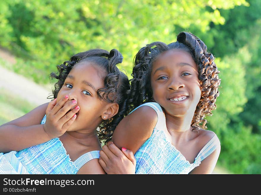 2 beautiful african american sisters enjoying the outdorrs. 2 beautiful african american sisters enjoying the outdorrs