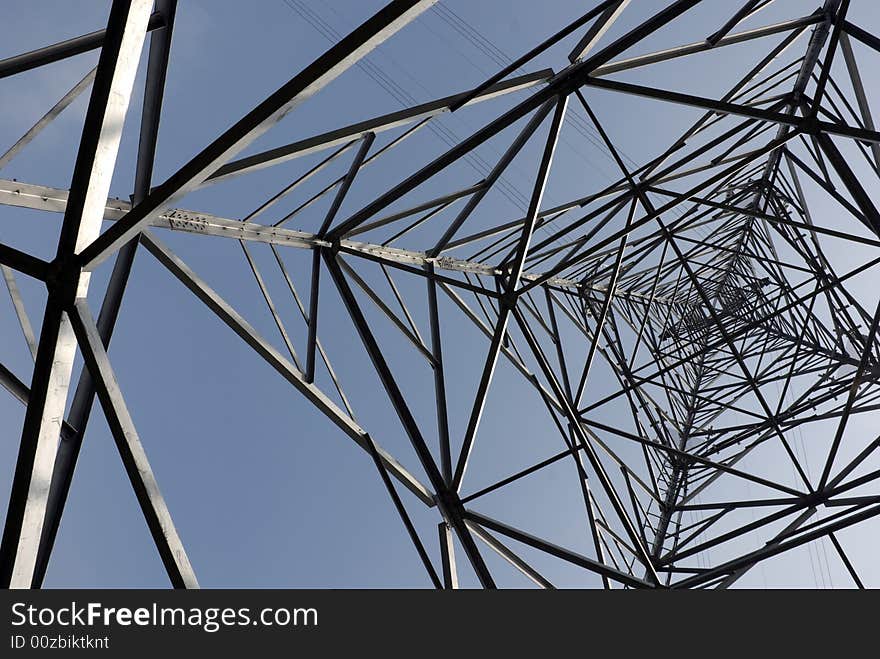 Impressive electric pylons transporting electricity through high tension cables. Impressive electric pylons transporting electricity through high tension cables.