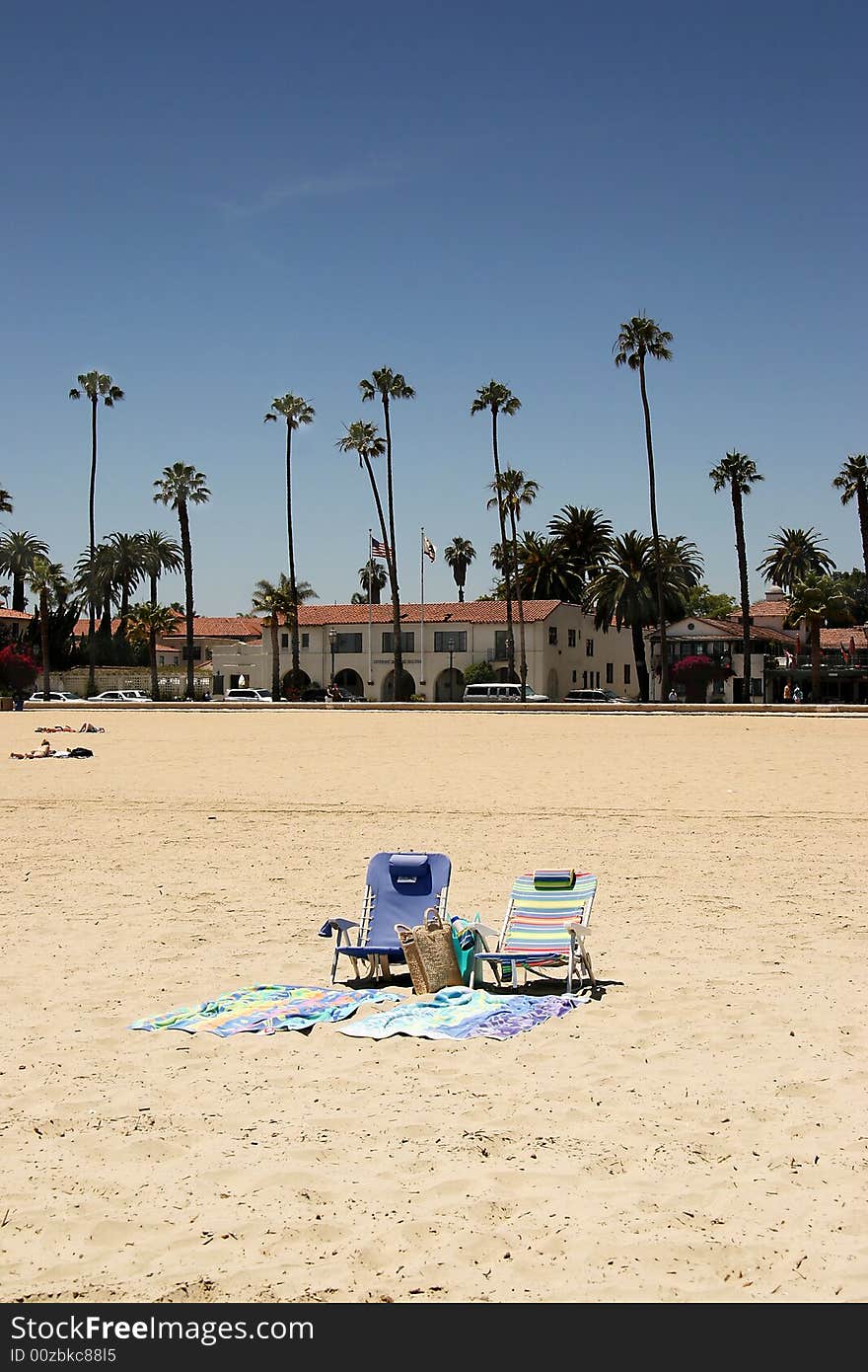 Chairs and towels set on the beach. Chairs and towels set on the beach