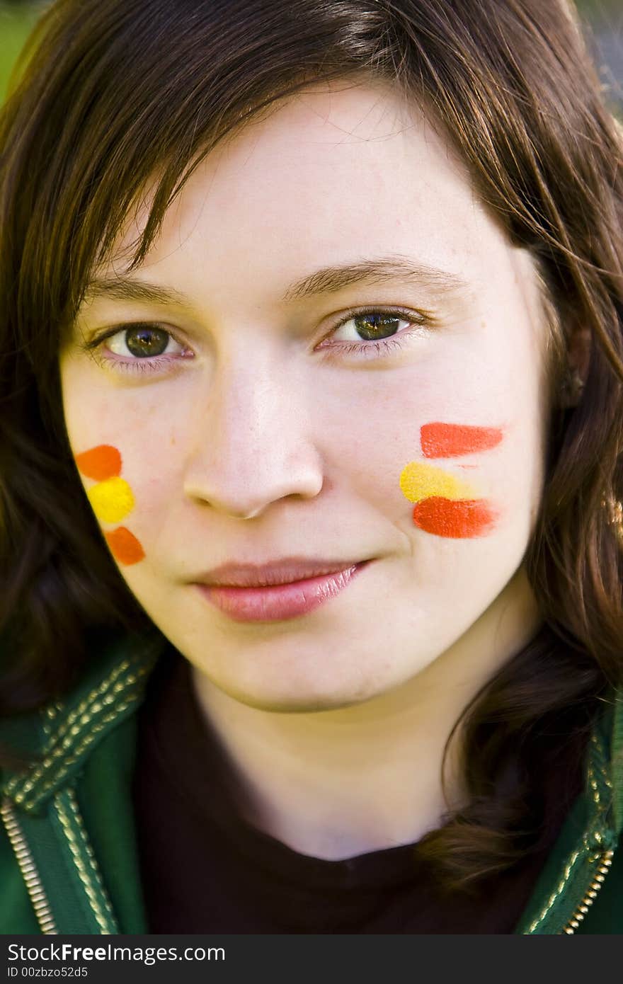 Young Spanish fan portrait starin at camera.