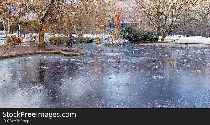 Frozen statue on frozen pond