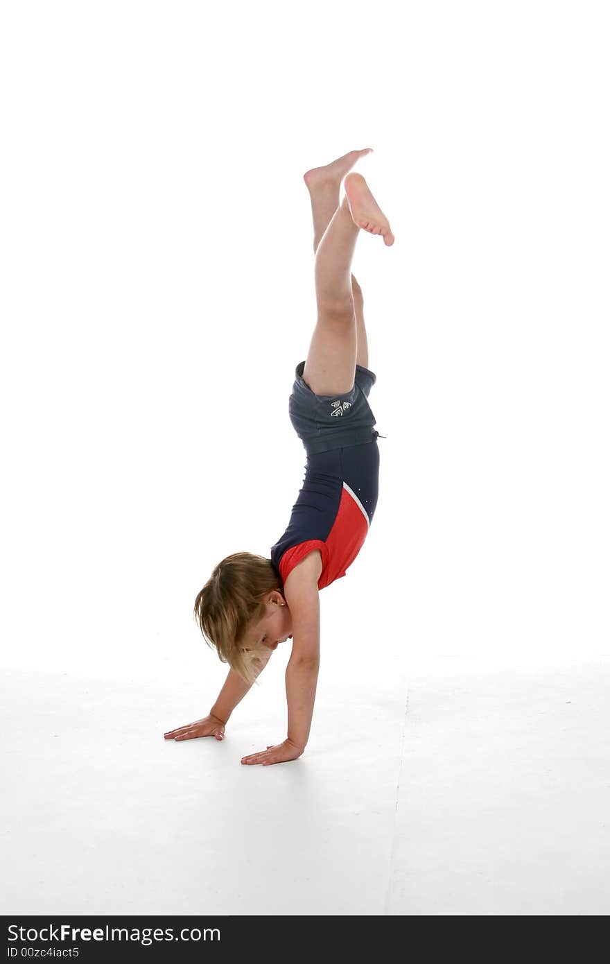 Young girl doing a handstand