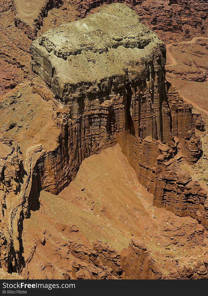 A mesa soaring up from the canyons carved by the Colorado River - Canyonlands National Park, Moab, Utah. A mesa soaring up from the canyons carved by the Colorado River - Canyonlands National Park, Moab, Utah.