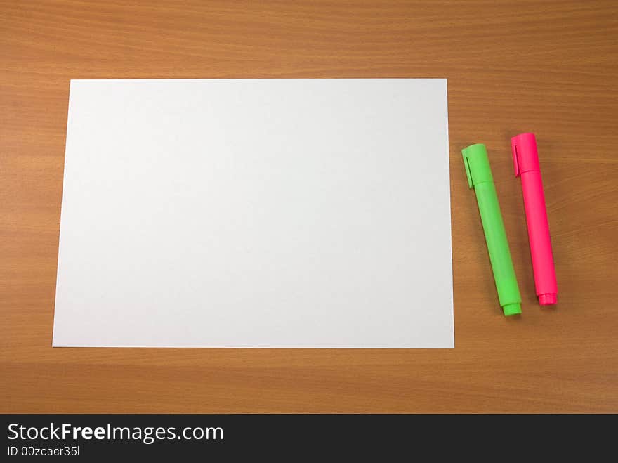 Two markers and blank paper sheet. Can be used as frame - paper color in RGB - 255,255,255. Two markers and blank paper sheet. Can be used as frame - paper color in RGB - 255,255,255