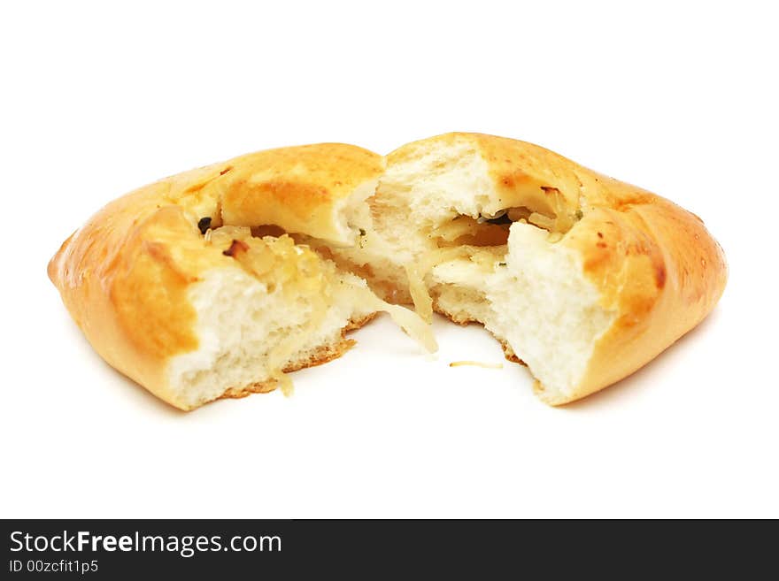 Bread sliced into half on white background.