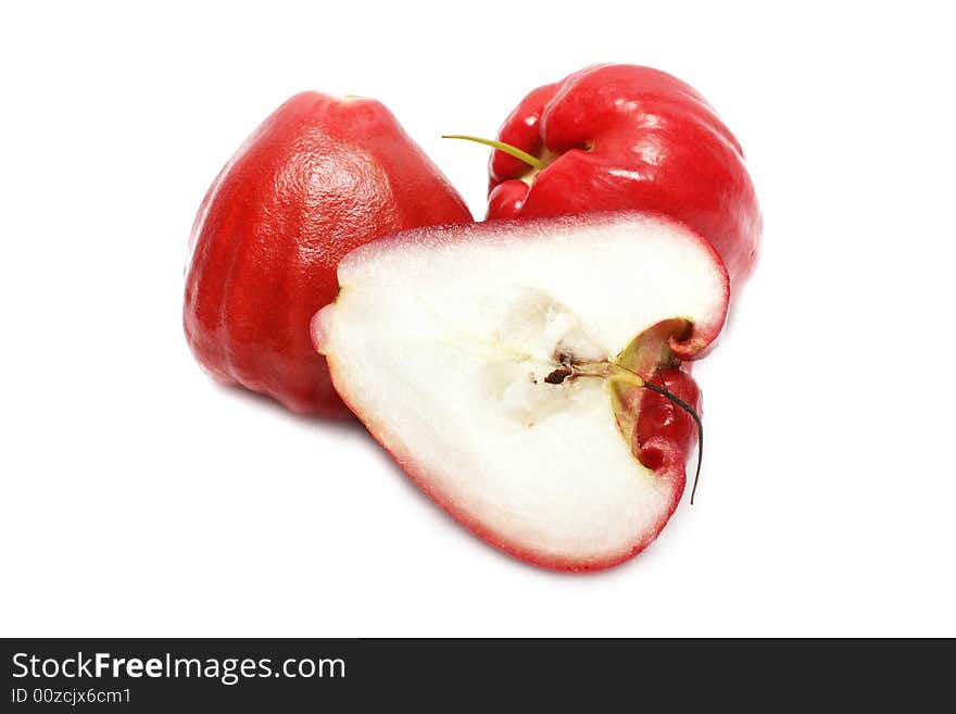 Water apple cut into half on white background. Water apple cut into half on white background.