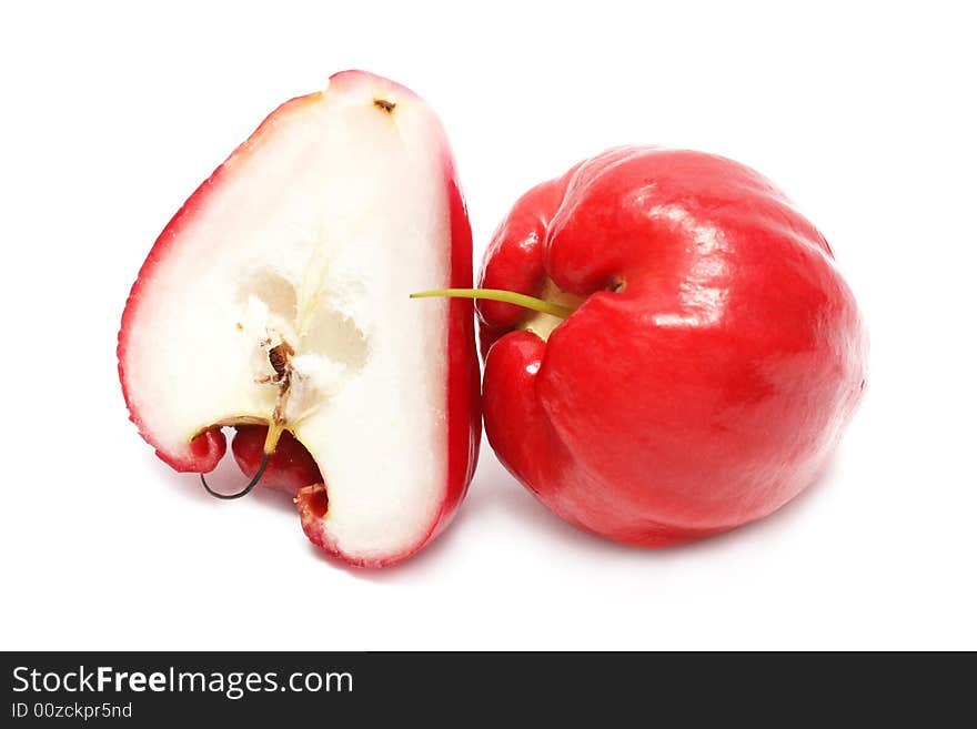 Water apple cut into half on white background. Water apple cut into half on white background.