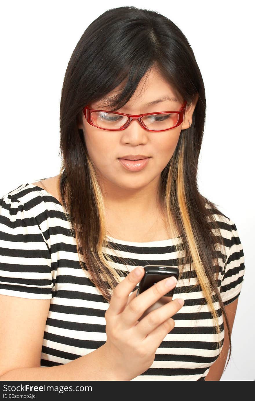 A woman sending a text message on her cellphone