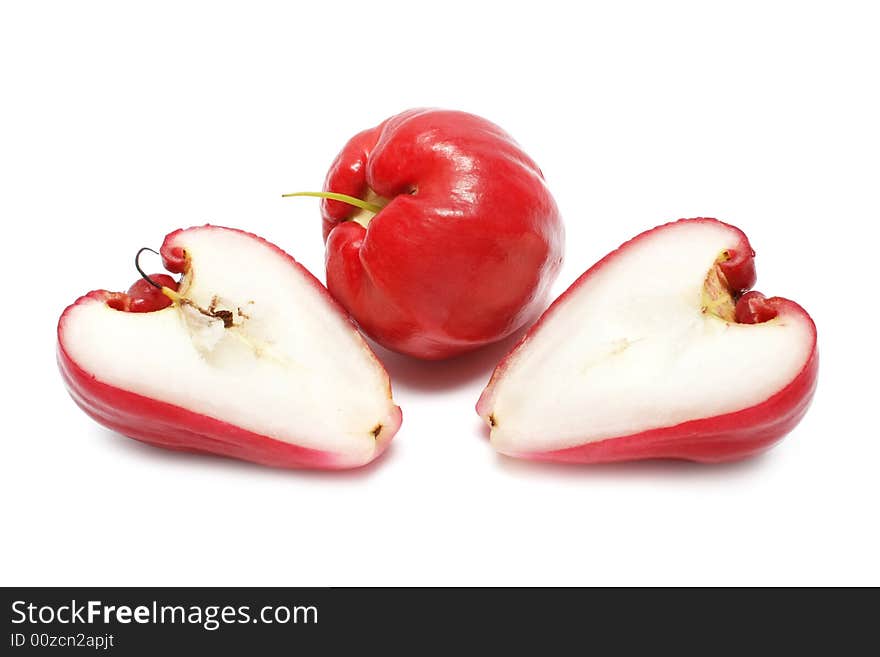 Water apple cut into half on white background. Water apple cut into half on white background.