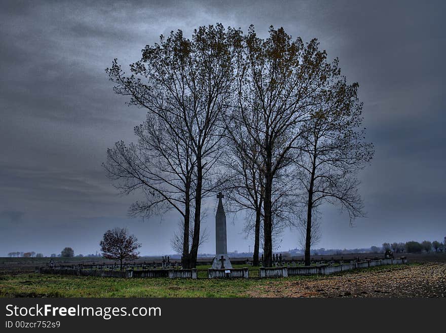 Old war cemetary witch trees and dark cloudy sky. Old war cemetary witch trees and dark cloudy sky.