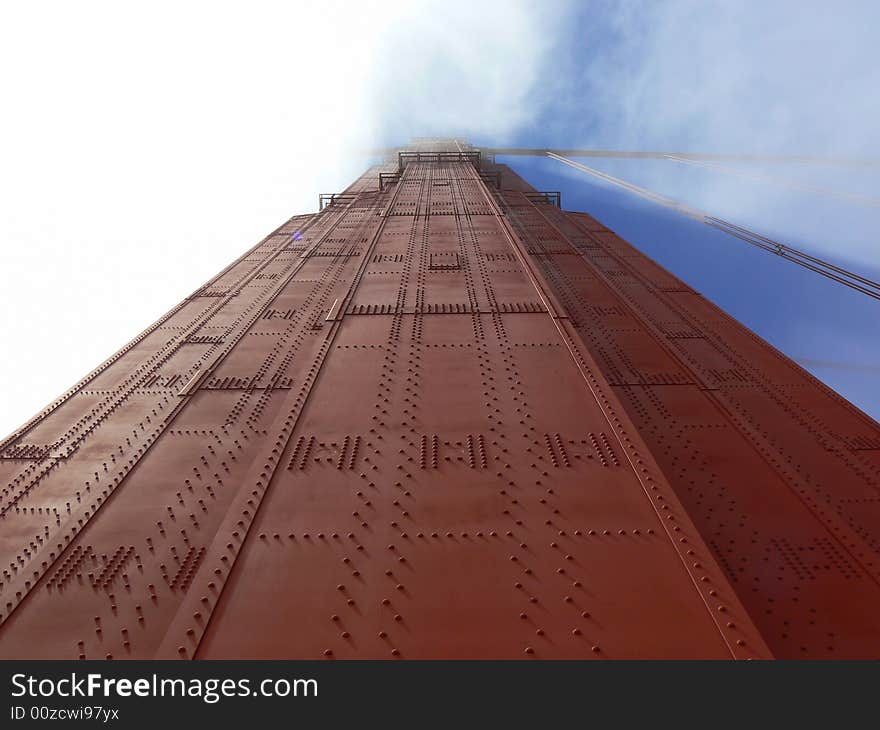 A detail of the Golden Gate bridge wrapped by the fog