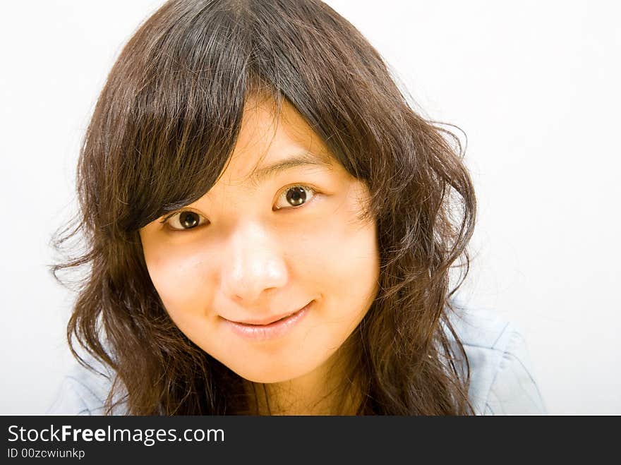 A young asian girl with big and bright eyes. A young asian girl with big and bright eyes