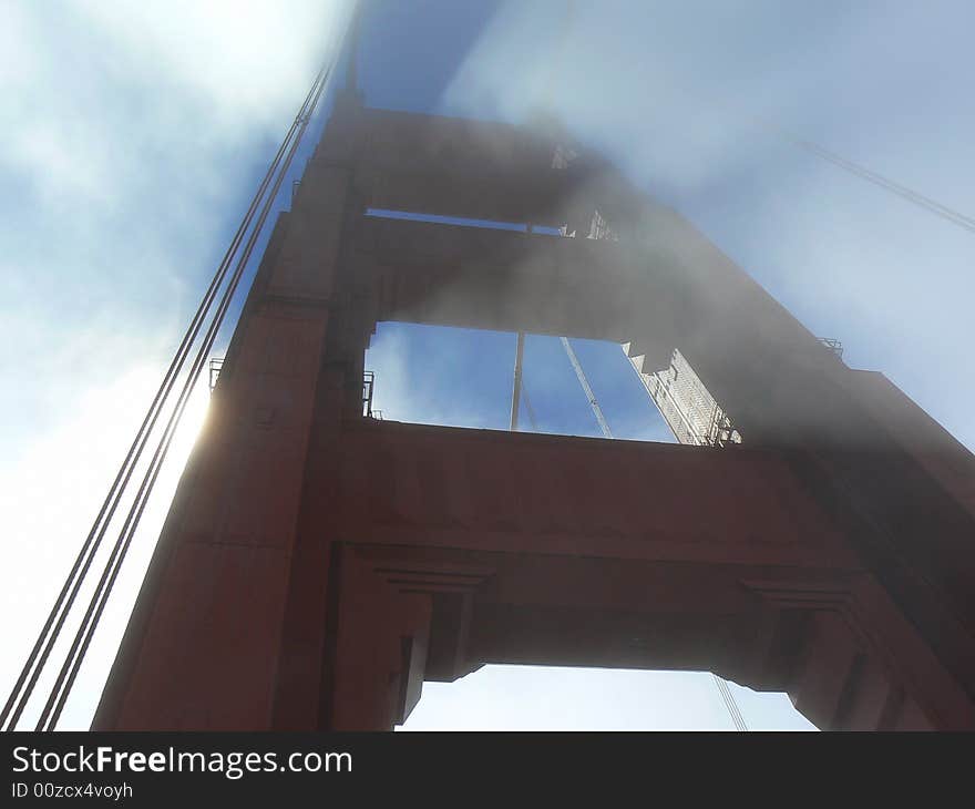 A detail of the Golden Gate bridge wrapped by the fog. A detail of the Golden Gate bridge wrapped by the fog