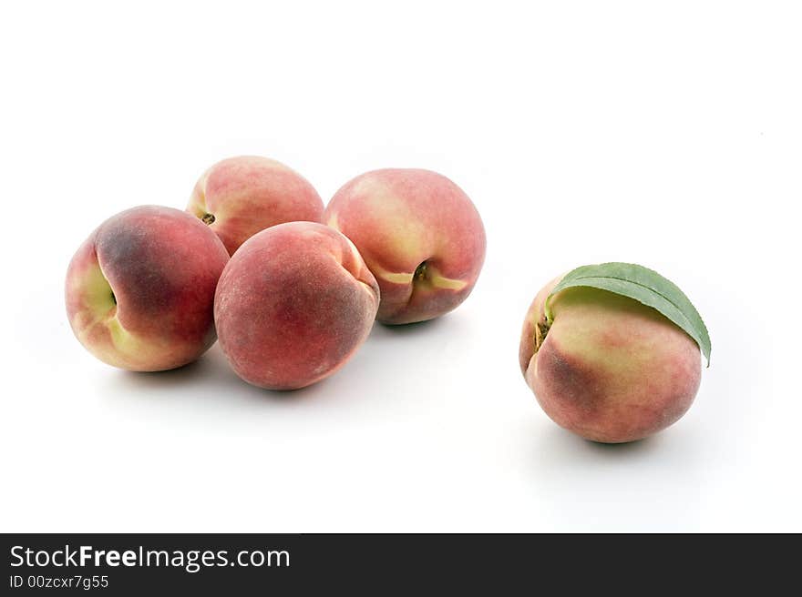 Group of peaches isolated on white