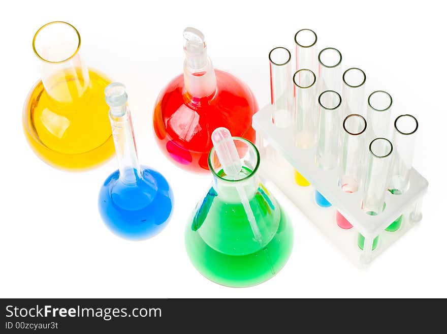 Various colorful glass laboratory ware on a white background. Various colorful glass laboratory ware on a white background