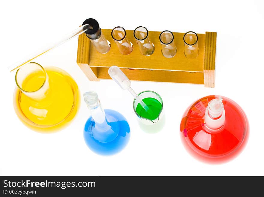 Various colorful glass laboratory ware on a white background. Various colorful glass laboratory ware on a white background