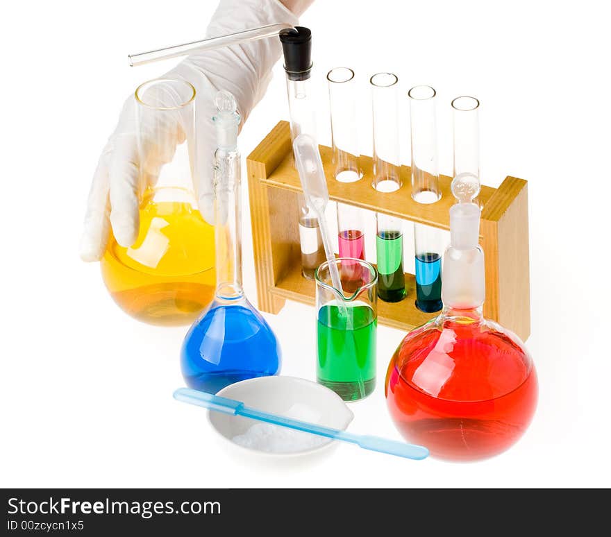 Various colorful glass laboratory ware on a white background. Various colorful glass laboratory ware on a white background