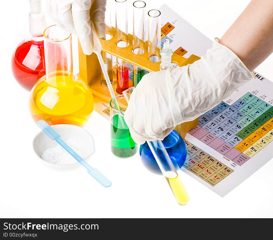 Various colorful glass laboratory ware on a white background. Various colorful glass laboratory ware on a white background