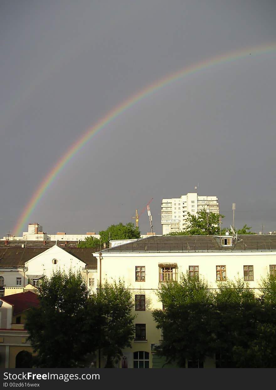 Beautiful rainbow on a background of the storm sky