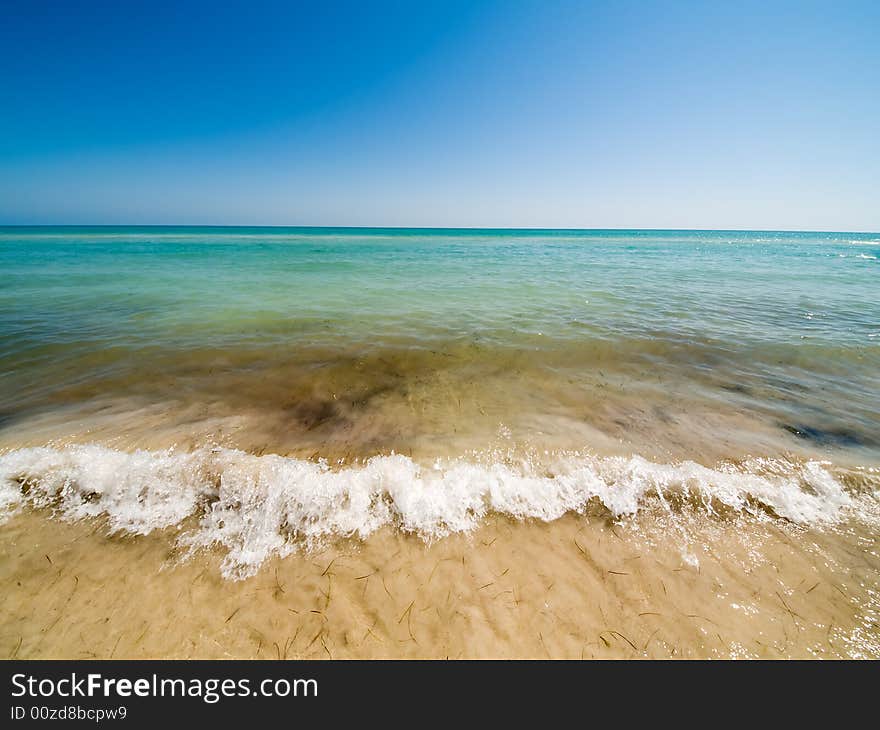 Empty lagoon beach and waves. Empty lagoon beach and waves