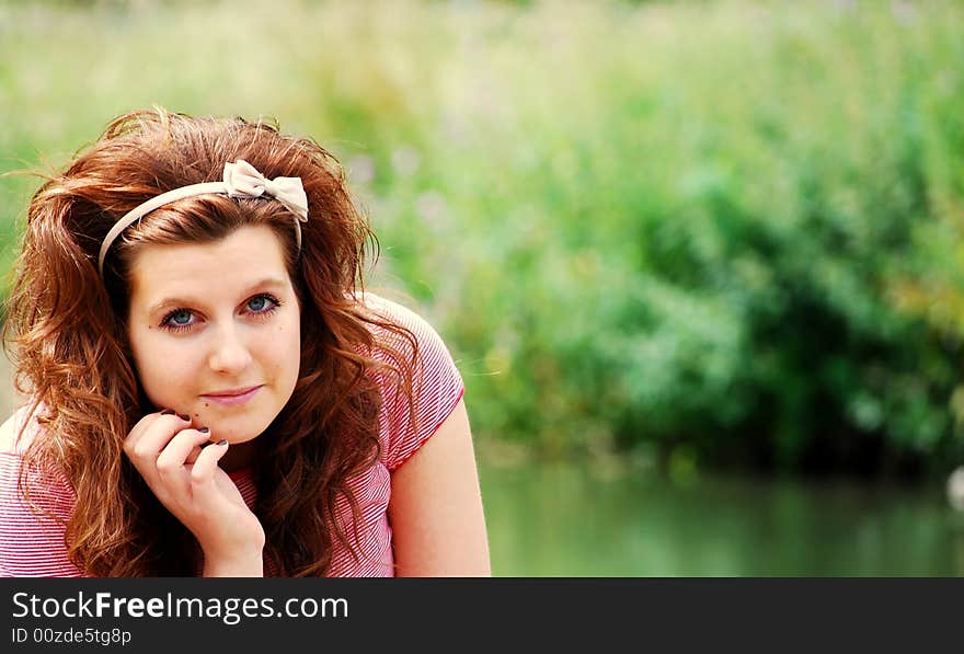 Pretty teenager by the river