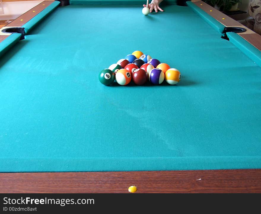 Billiard table with billiard's balls and men's hand. Billiard table with billiard's balls and men's hand