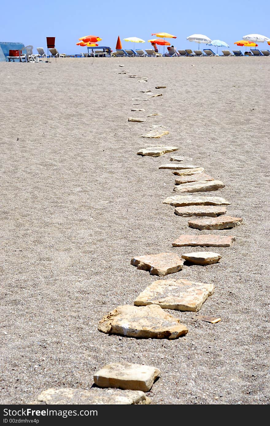 Stone path on the scorching sand. Stone path on the scorching sand