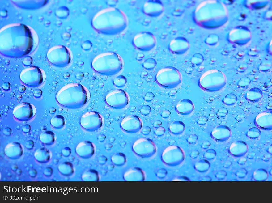 Water bubbles on a blue surface