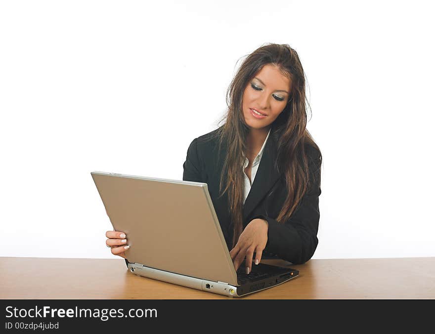 Attractive businesswoman, smiling, typing on laptop computer, isolated on white background, studio work