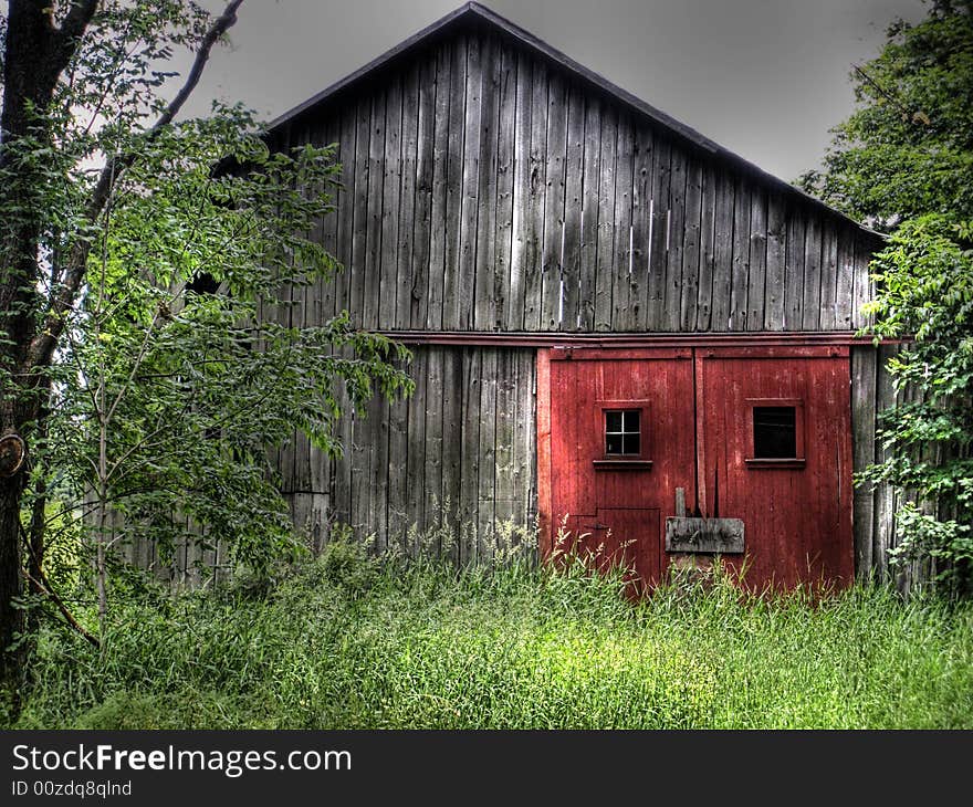 Rustic red doors on a dilapidated barn. Rustic red doors on a dilapidated barn.