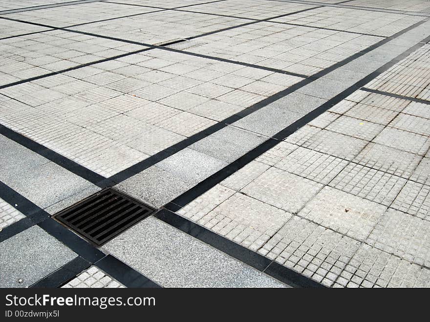 Structured street marble and bricks pavement.