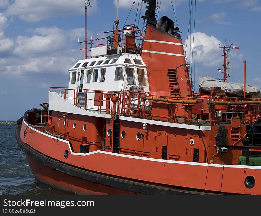 A huge tugboat in a harbor. A huge tugboat in a harbor