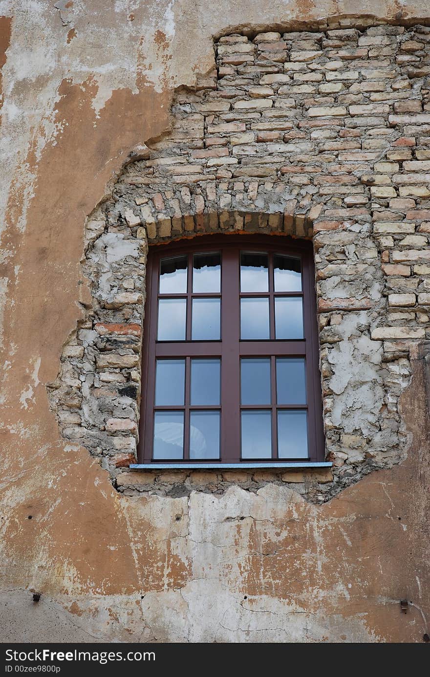 The new window reflecting sky in the old building. The new window reflecting sky in the old building