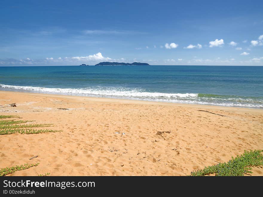 Picture of faraway Kapas Island in Malaysia taken from mainland with blue sea blue sky and sandy beach. Picture of faraway Kapas Island in Malaysia taken from mainland with blue sea blue sky and sandy beach.