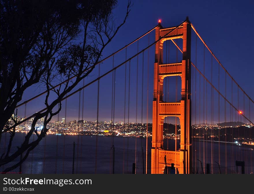 Image of golden gate bridge at night with skyline. Image of golden gate bridge at night with skyline