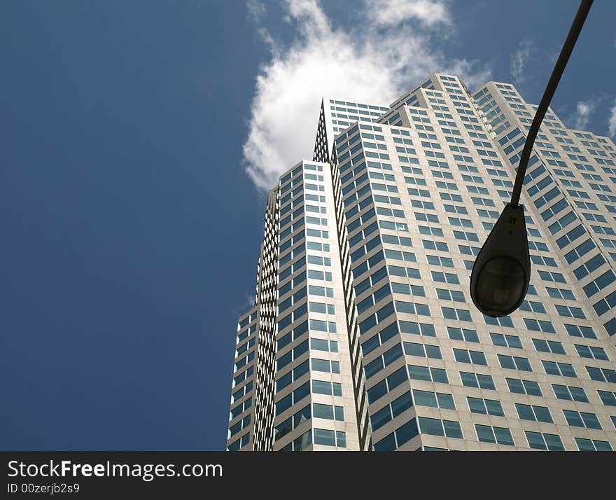 Office tower over lamp post