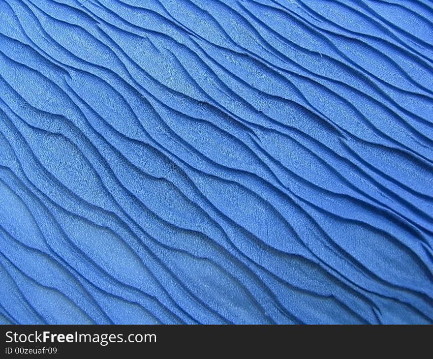 Beautiful blue shawl texture like sea waves. Beautiful blue shawl texture like sea waves.