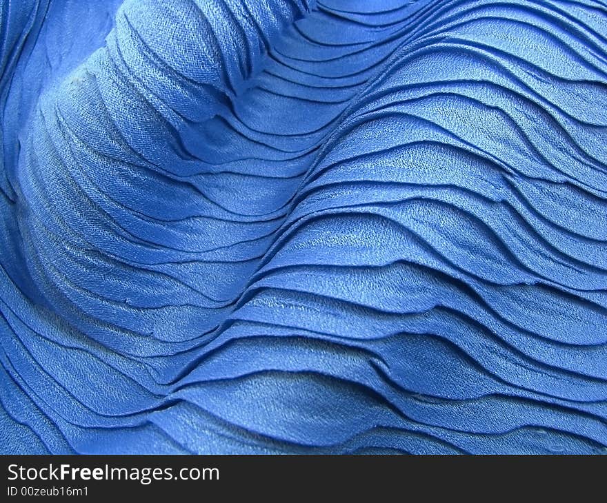 Beautiful blue shawl texture like sea waves. Beautiful blue shawl texture like sea waves.