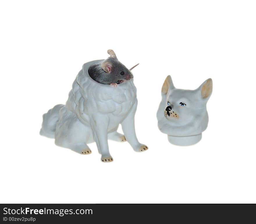 Mouse hiding in the dog's porceline sculpture. Mouse hiding in the dog's porceline sculpture