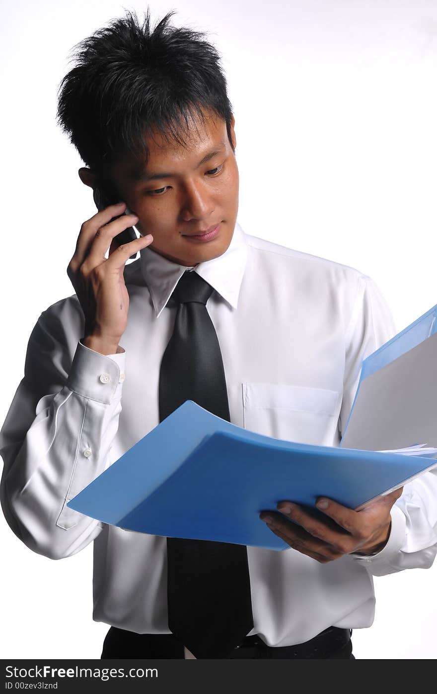 Asian Business Man Looking At File With Phone