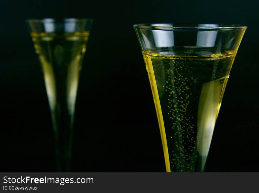 Sparkling wine isolated against a black background