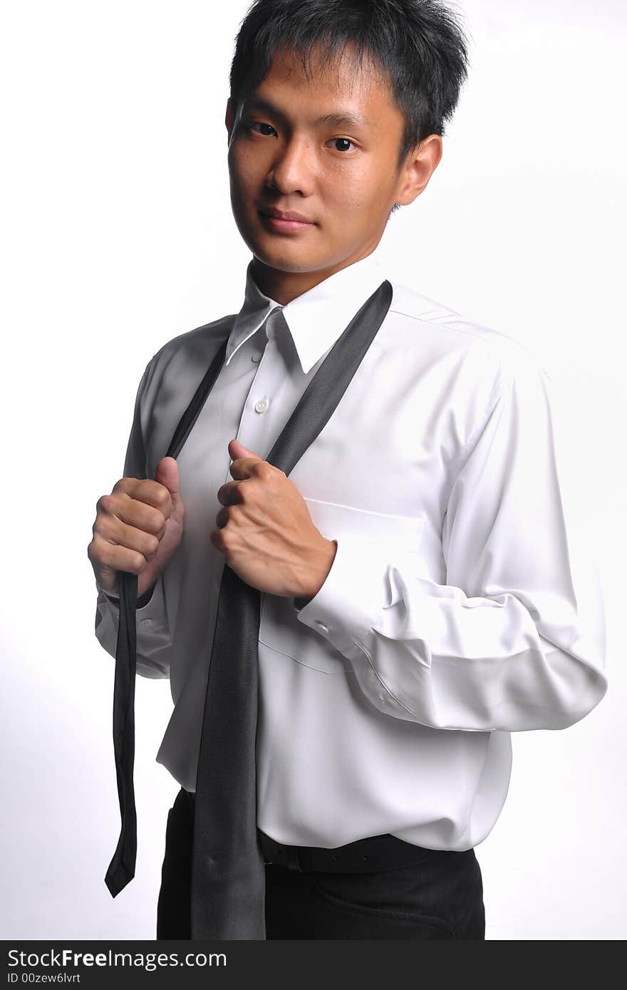 Asian business man loosening tie after work. Asian business man loosening tie after work