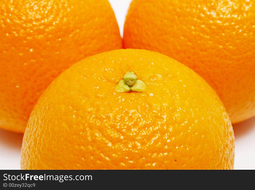 Closeup of three oranges as whole background.