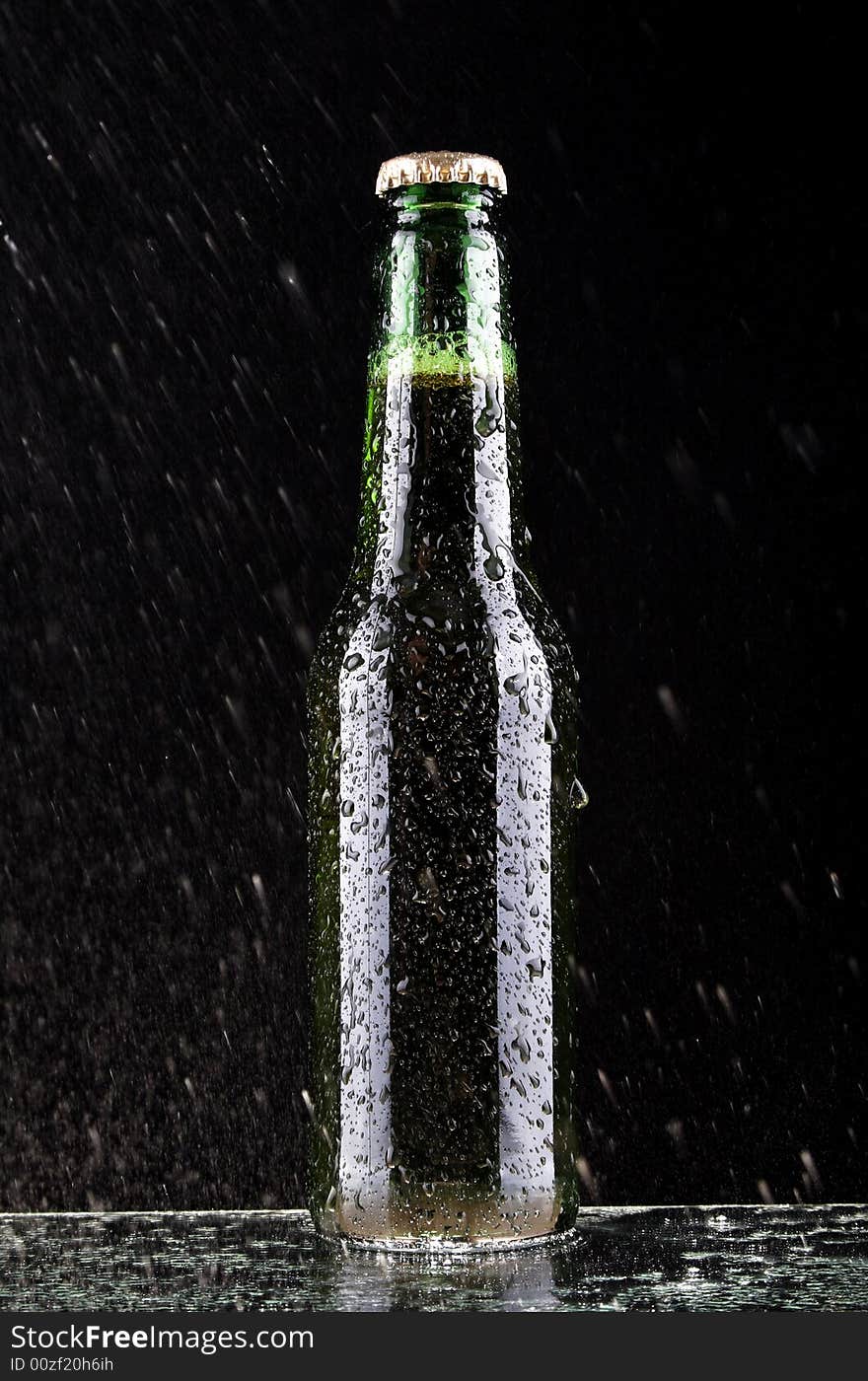 Studio shot of wet glass of beer