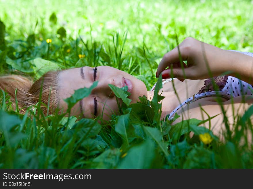 Portrait of the beautiful young girl on nature