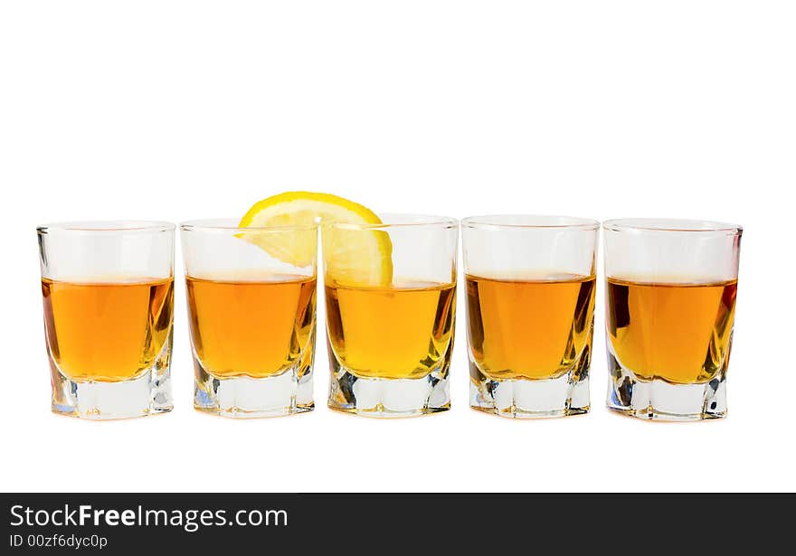 Drink and a slice of fresh lemon isolated on white background. Drink and a slice of fresh lemon isolated on white background.