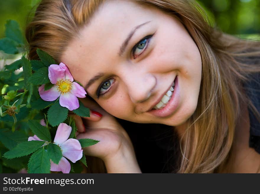 Portrait of the beautiful young girl on nature