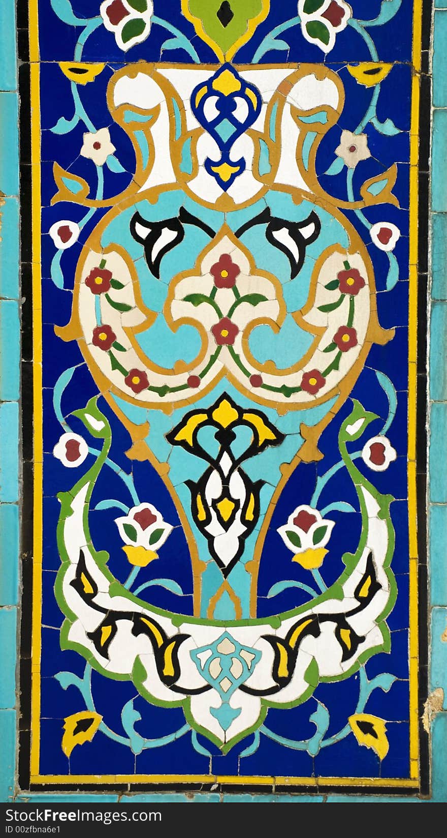 Details of a colorful mosaic designed with ceramic tiles depicting floral patterns. Details of a colorful mosaic designed with ceramic tiles depicting floral patterns